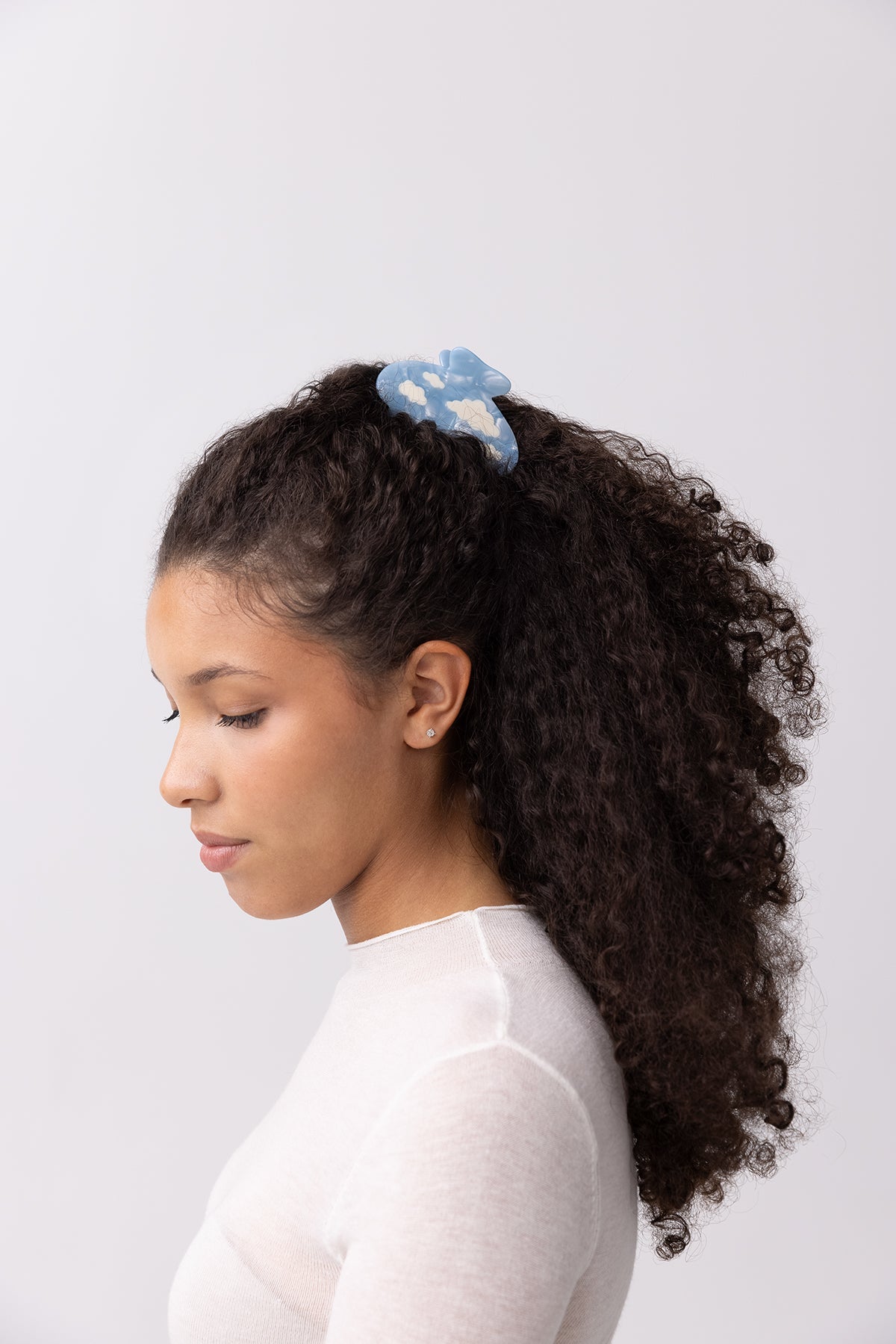 Lucy Hair Claw Blue Sky Clouds